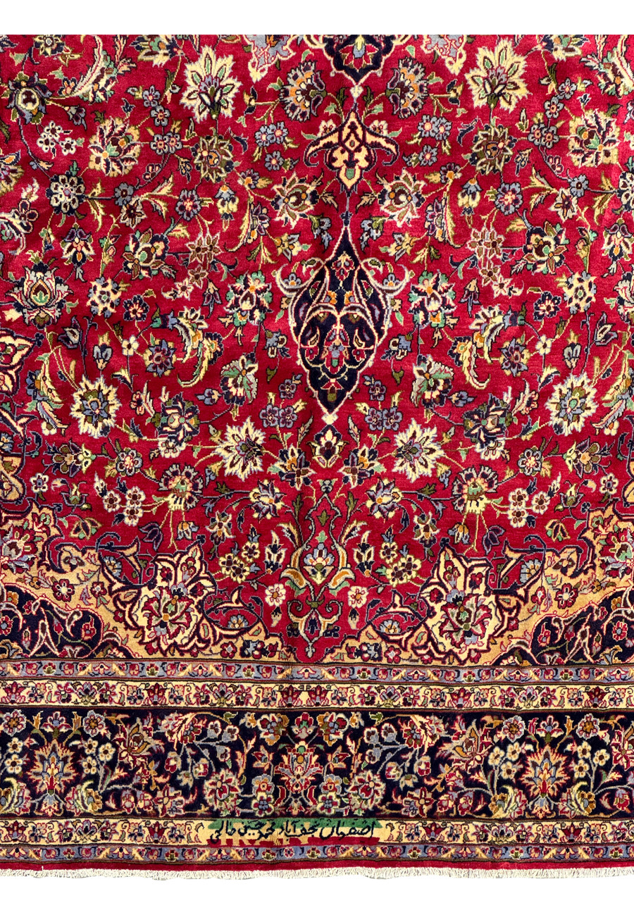 Textural detail of Persian Isfahan rug weaving - Close-up image showing the texture and weave density of the Persian Isfahan rug, highlighting the quality of materials used.