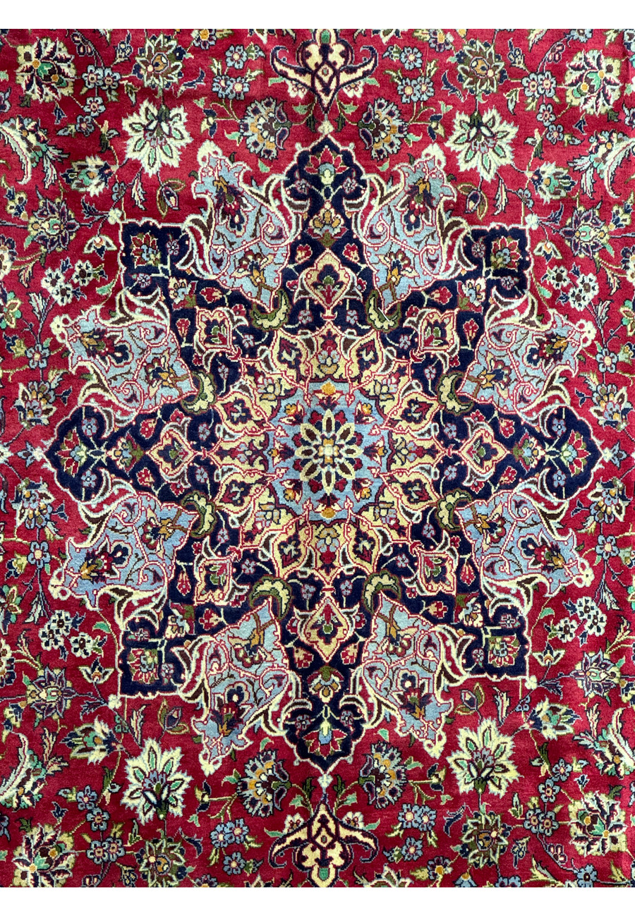 Mid-section of Persian Isfahan rug - Detailed view of the middle section of the Persian Isfahan rug, focusing on the symmetry and patterns of the design.
