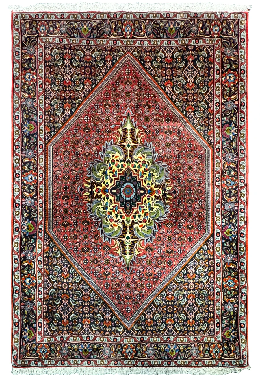 Vibrant medallion Bidjar on a deep red ground with ivory corner spandrels