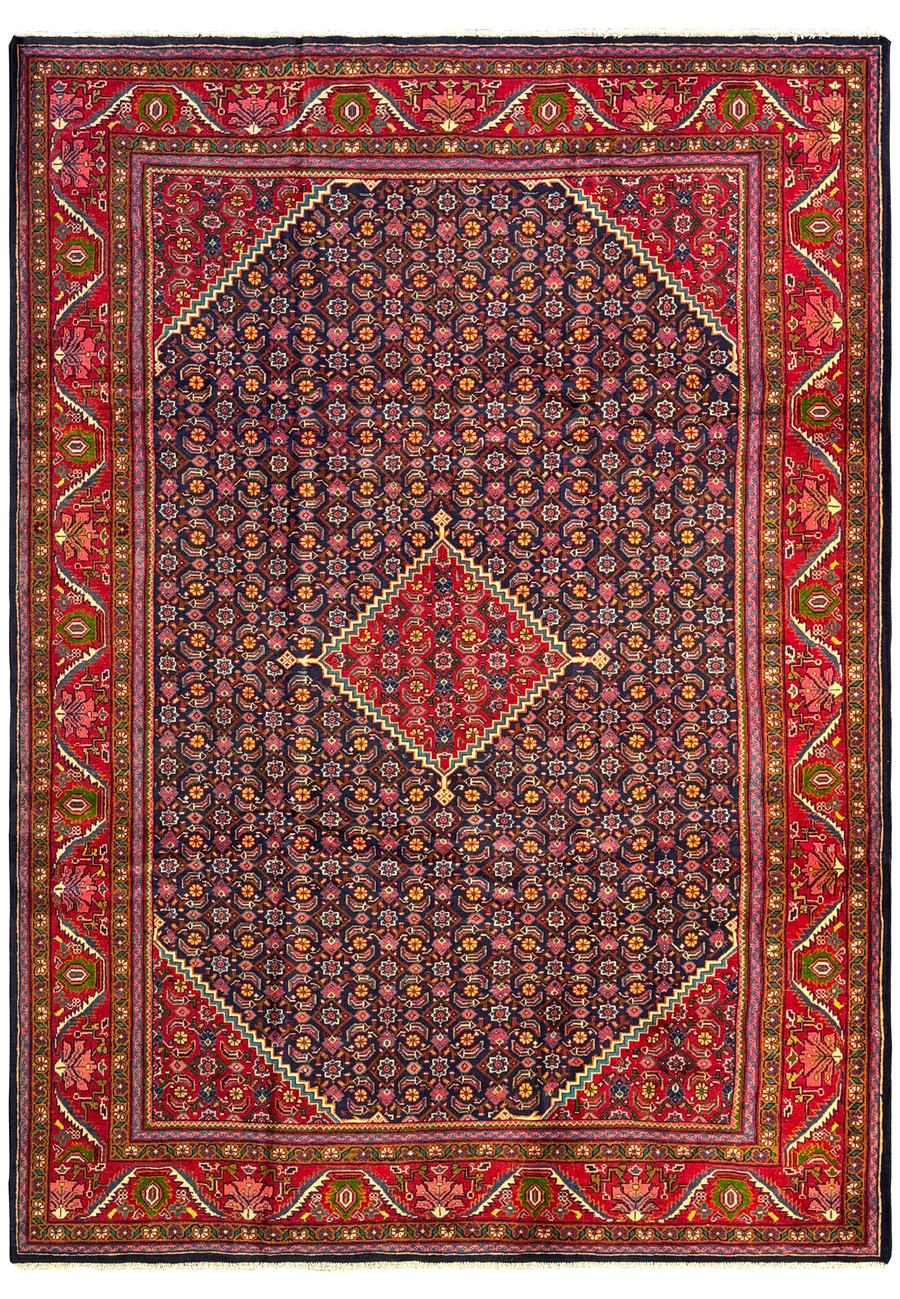 Top view of a 9'3 x 12'9 Persian Mahal Rug showcasing intricate floral and geometric patterns in rich navy and red colors. The central field features a complex array of floral motifs set against a dark navy background, while the vibrant red border is adorned with detailed geometric and botanical designs. The craftsmanship is highlighted by the harmonious balance of colors, creating a visually striking and elegant piece suitable for any sophisticated interior.