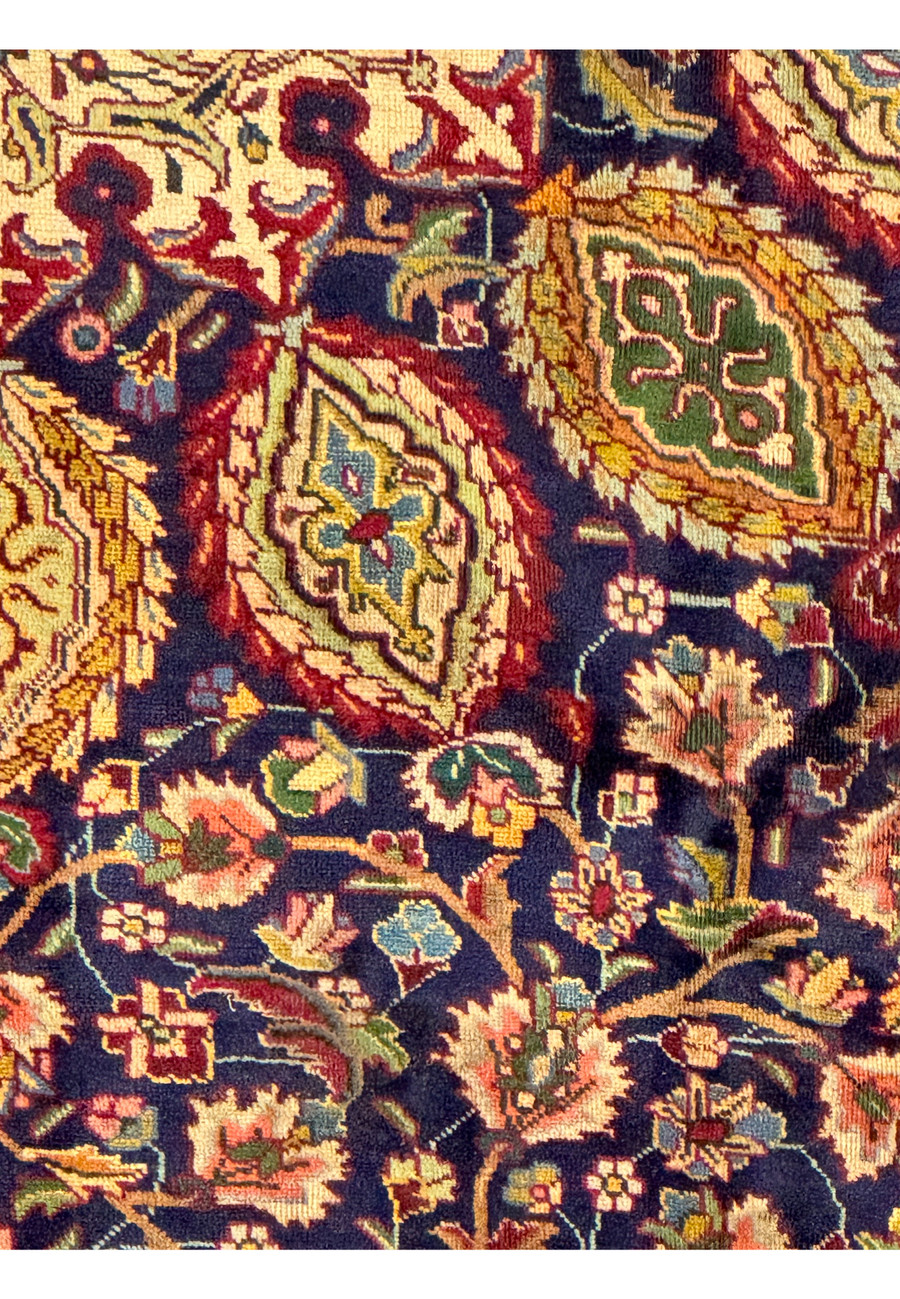 An image showing the back of the Persian Tabriz Rug, with a portion of the front visible for comparison. The intricate knotting and high-quality wool are evident, showcasing the rug's construction and durability. The detailed patterns and vibrant colors of the front are mirrored in the tightly woven knots on the back, highlighting the precision of the craftsmanship.