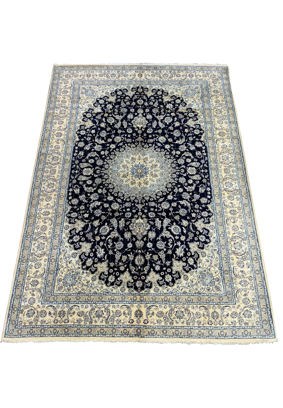 Full view of a 13'2 x 19'4 Nain Persian rug laid down