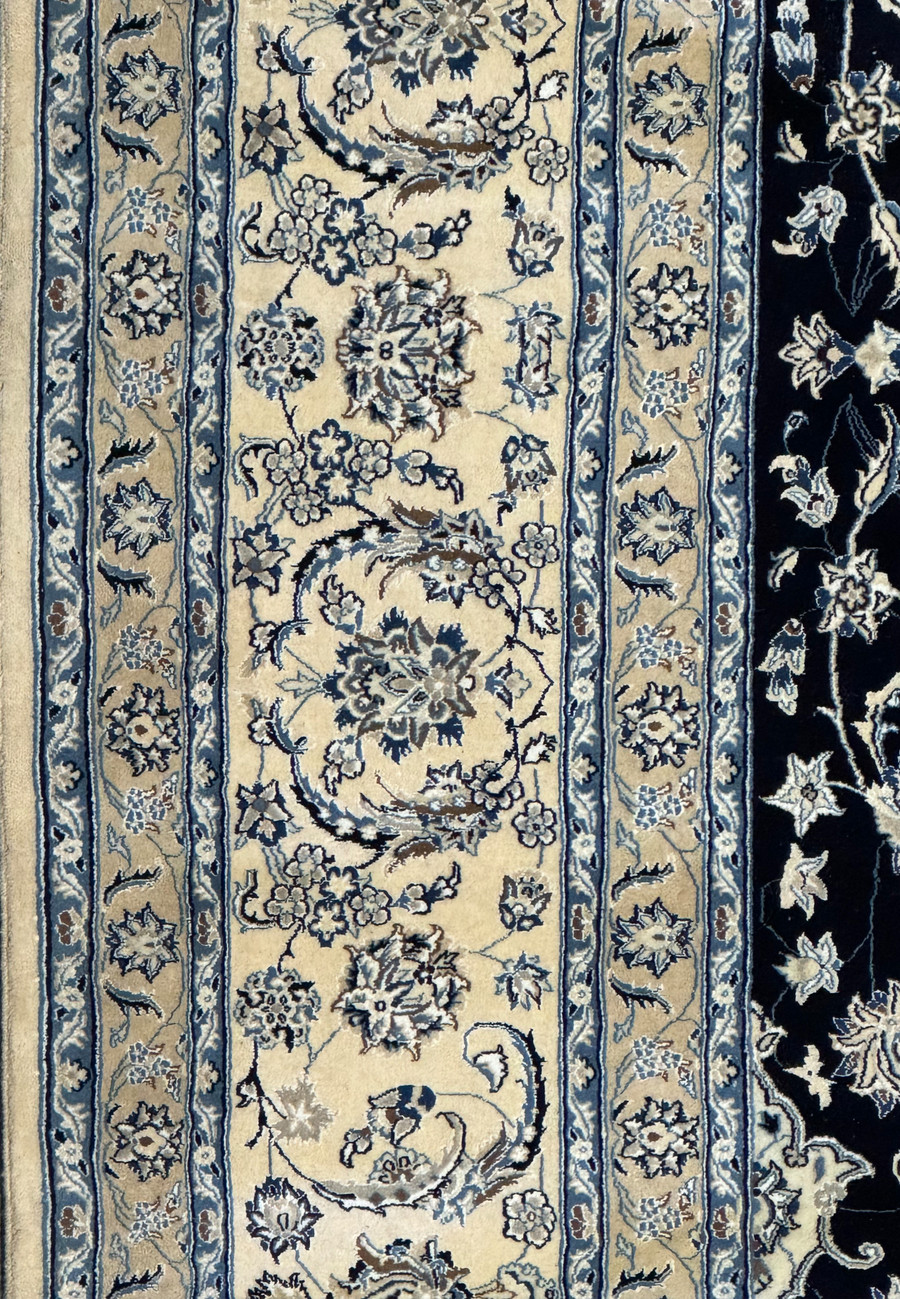 Detailed shot of the edge border on the 13'2 x 19'4 Nain Persian rug