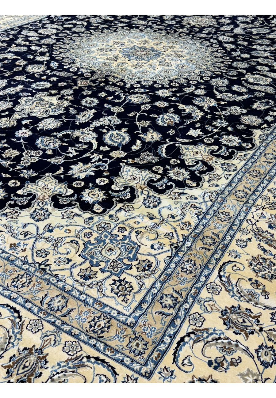 Side view of the 13'2 x 19'4 Nain Persian rug showing intricate patterns