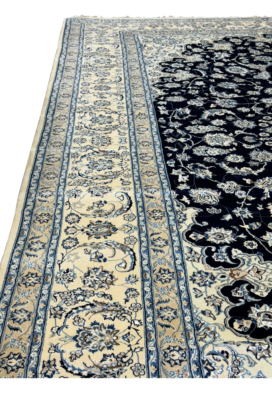 Complete side of the Nain wool and silk 13'2 x 19'4 Persian rug