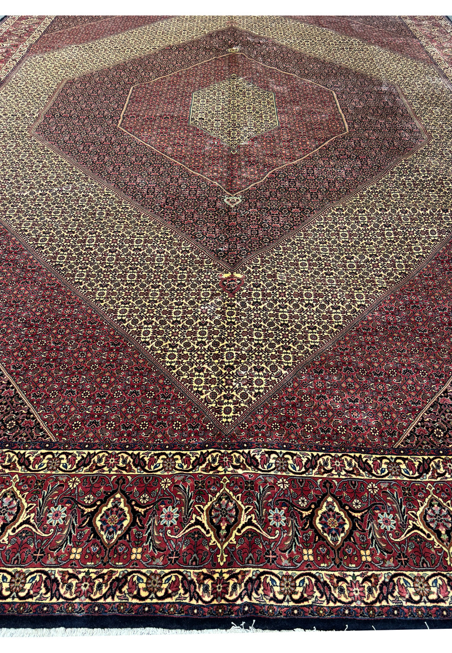 Detailed shot of the geometric patterns on a 13x19'7 Persian Bijar Rug.