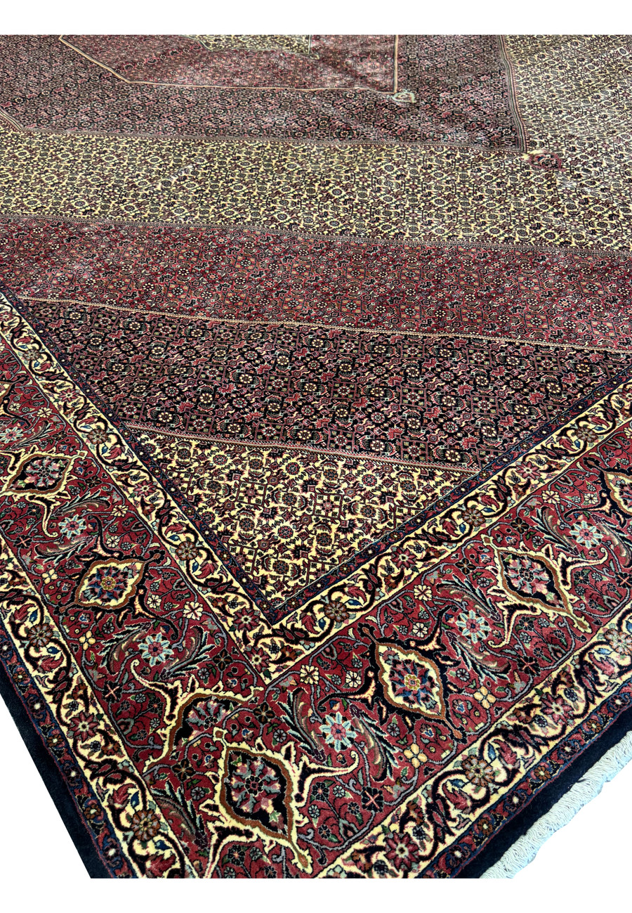 Top corner view of a 13x19'7 Persian Bijar Rug with intricate medallion and border patterns.