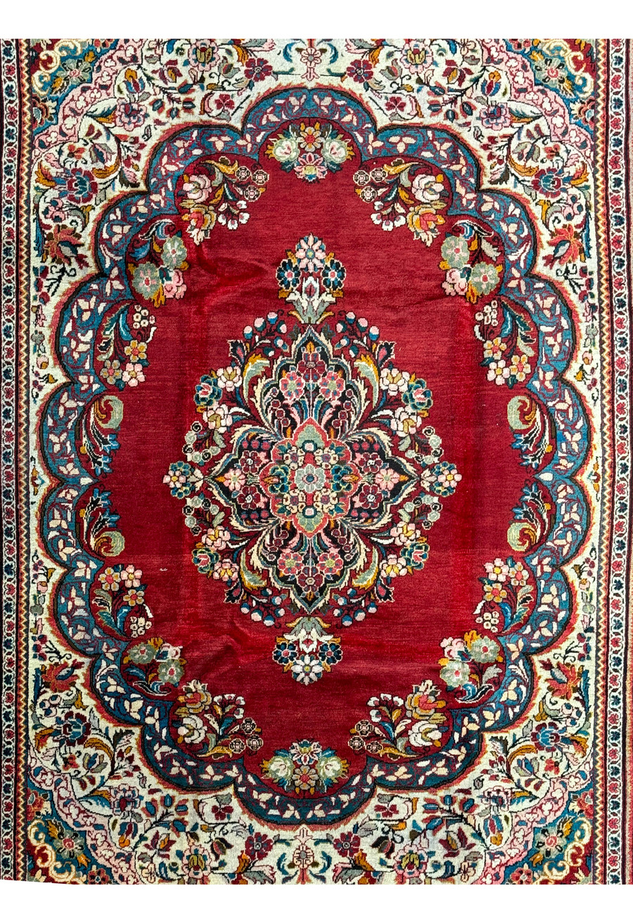 Angled shot of a large 10'7 x 13'5 Persian Mahal rug highlighting its detailed design and vibrant colors.