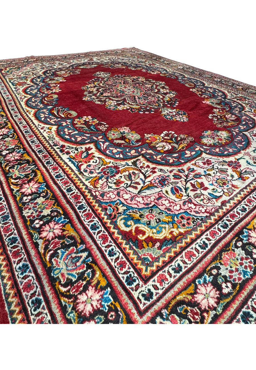 Detailed close-up of the floral motifs on a 10'7 x 13'5 Persian Mahal rug.
