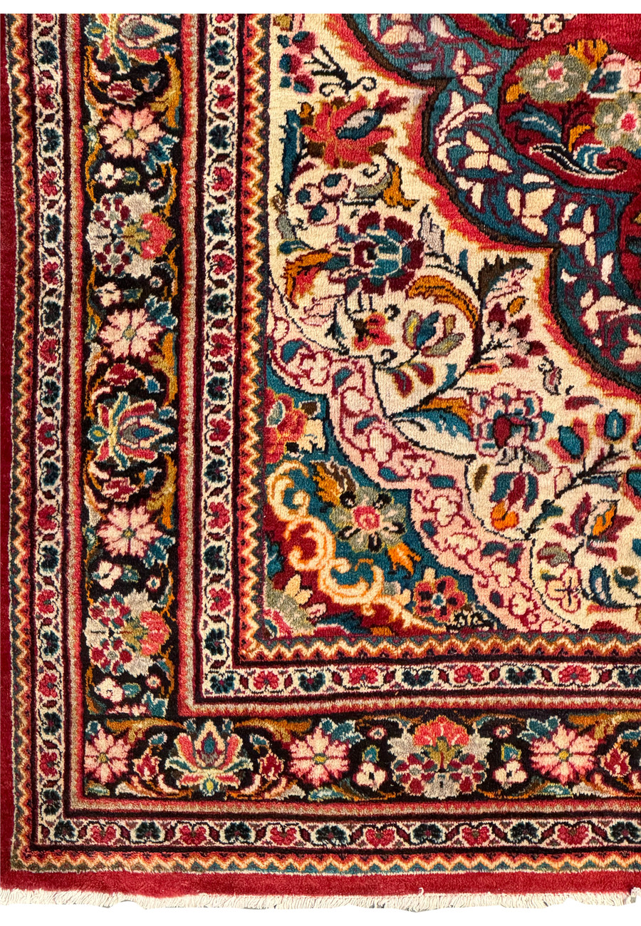 Corner view of a 10'7 x 13'5 Persian Mahal rug emphasizing its rich colors and intricate motifs.