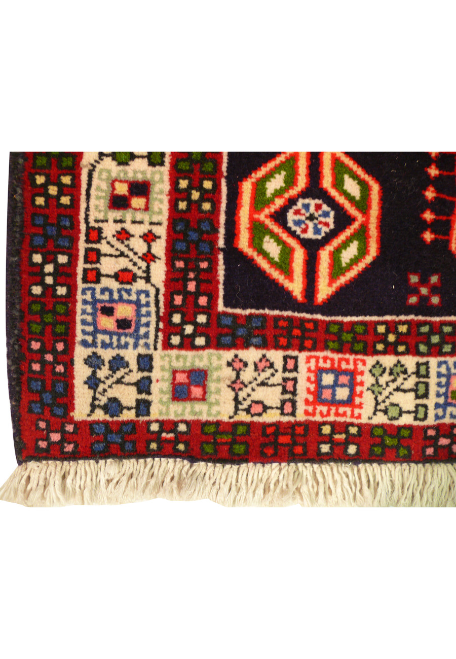 Corner fold of 2'7 x 9'6 Persian Yalameh Runner Rug - Revealing the reverse side and measuring tape indicating size