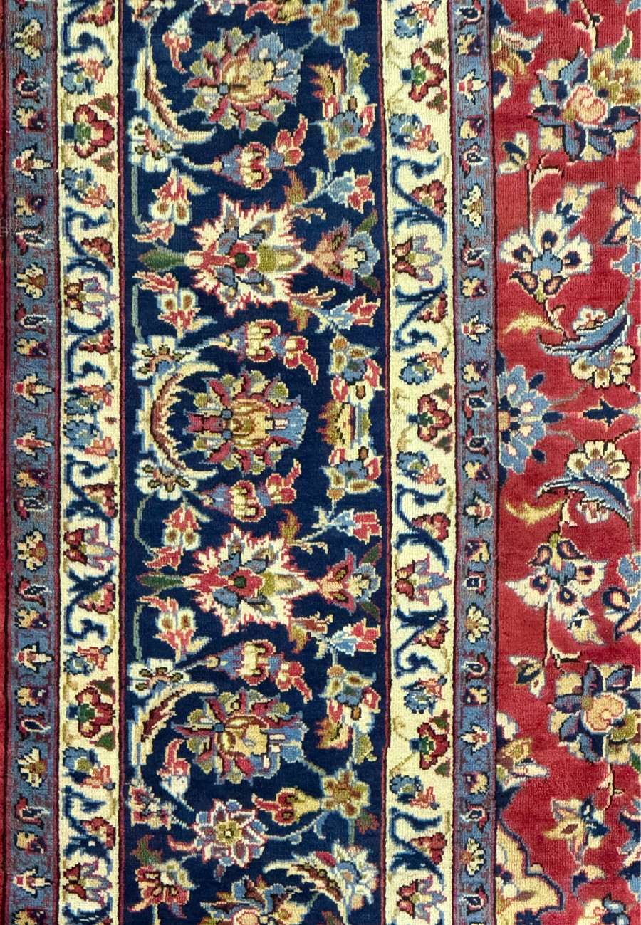 Edge and fringe detail of 10'2 x 13'6 Persian Isfahan Rug showing border patterns.