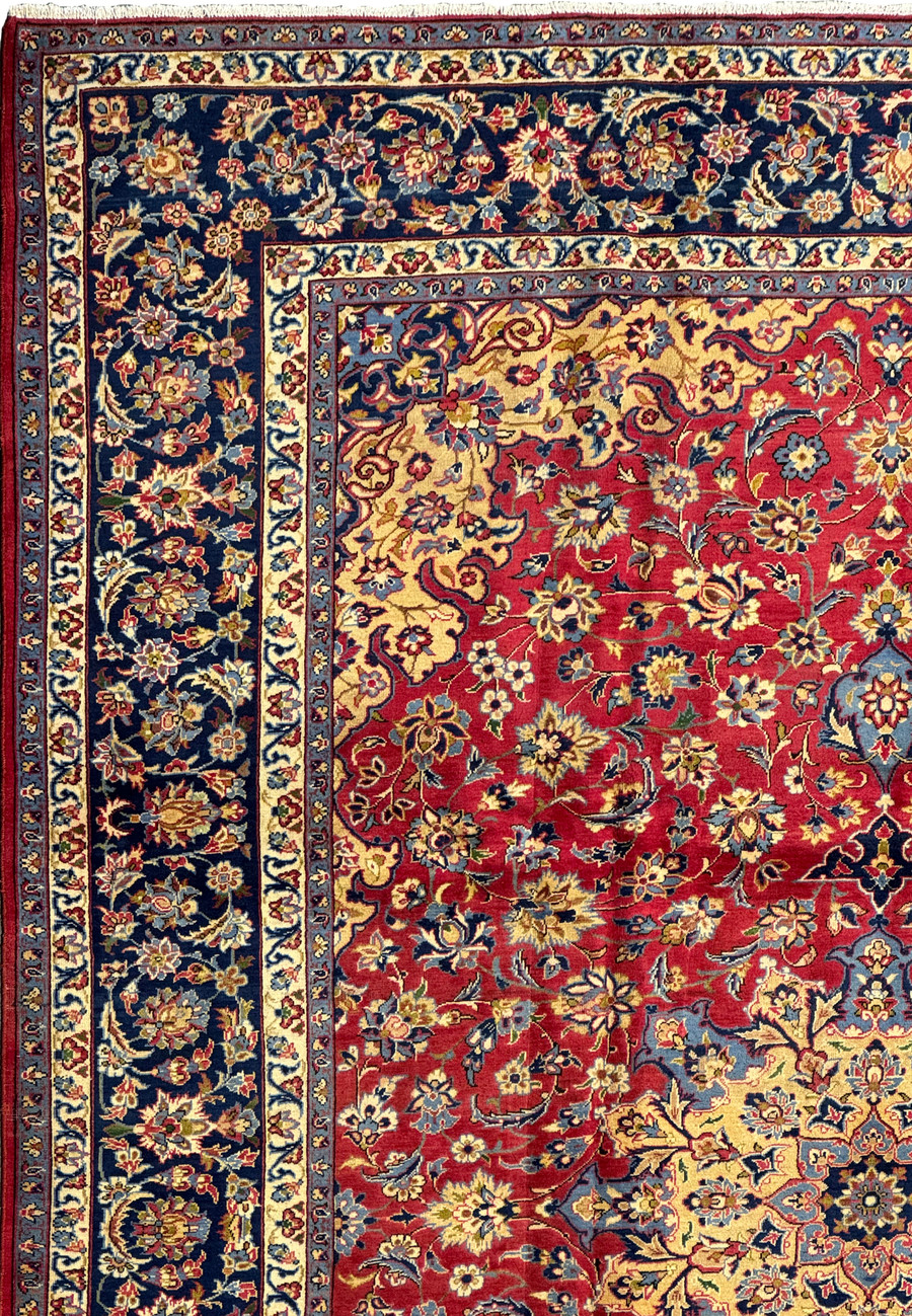 Detailed view of floral motifs on 10'2 x 13'6 Persian Isfahan Rug with red background