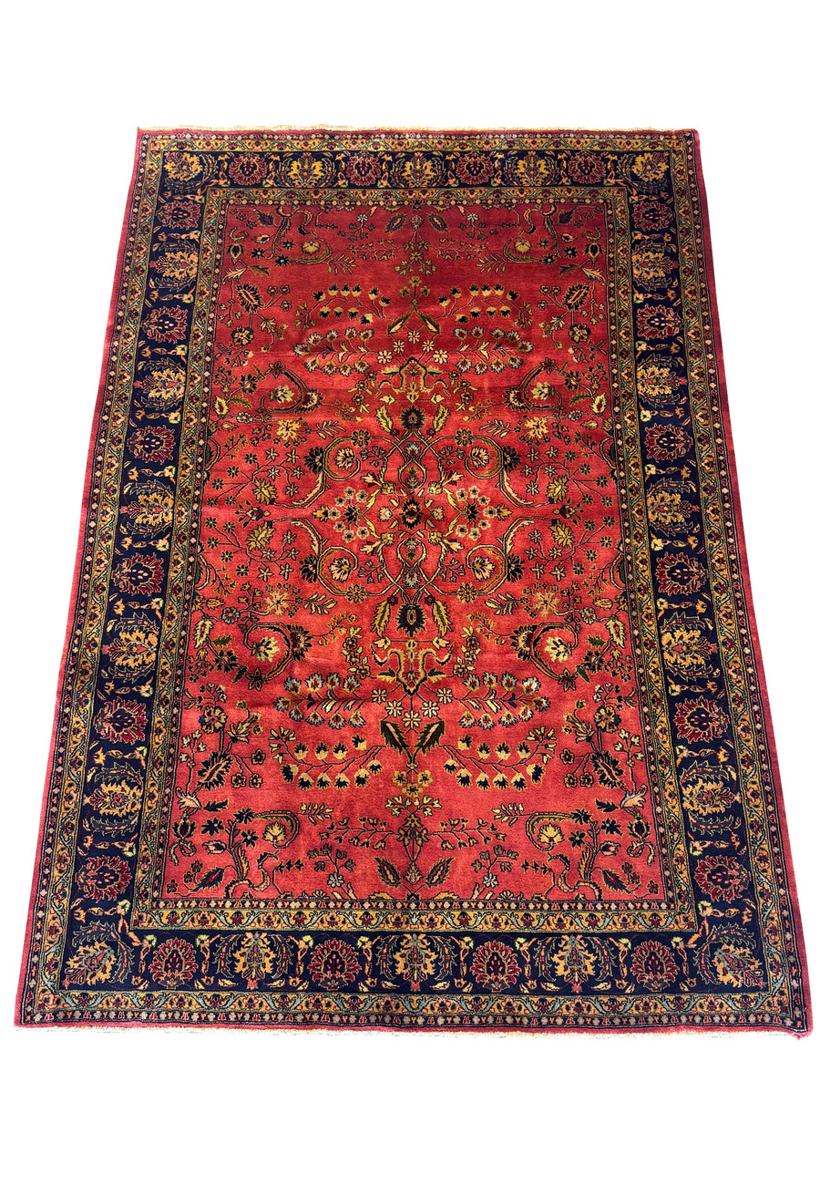 Overall view of the 6'5 x 9'6 American Sarough Rug with rich red background and intricate design