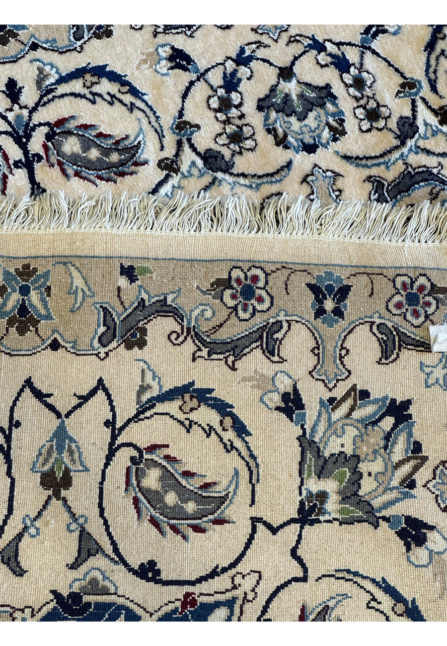 Back view of the 6'8 x 10'4 Persian Nain 9LAA Wool & Silk Rug, showcasing the detailed knotting and craftsmanship