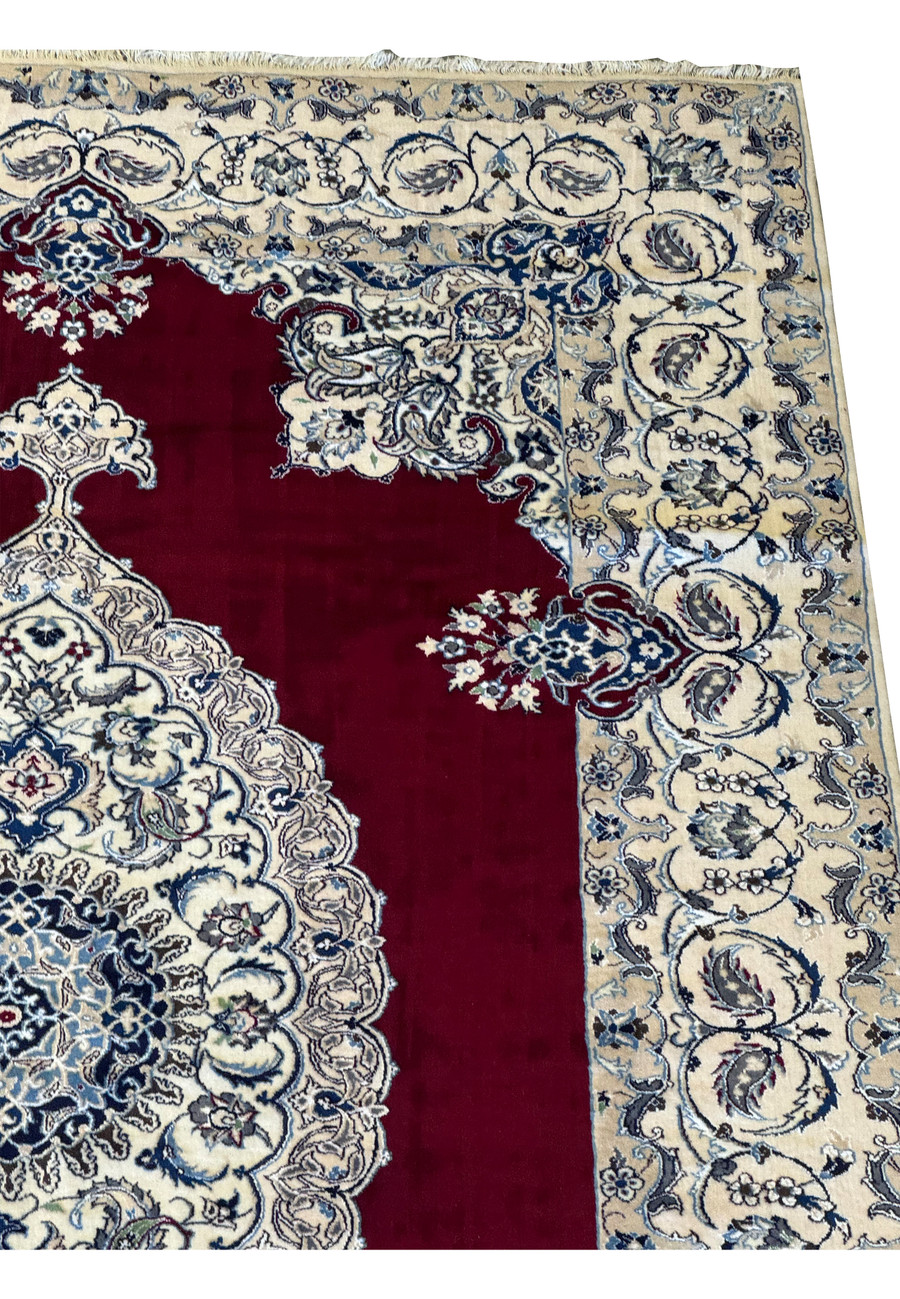 Upper side border and detailed midfield of the 6'8 x 10'4 Persian Nain 9LAA Wool & Silk Rug, highlighting the floral motifs and craftsmanship.