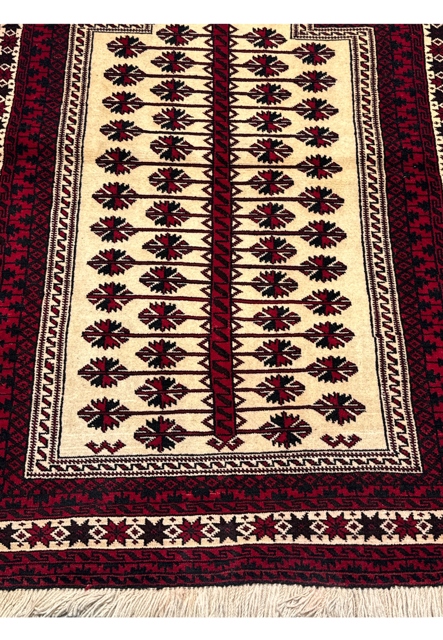 Lower section of a 3'6 x 5'4 Persian Baluch Rug displaying the fringe detail.