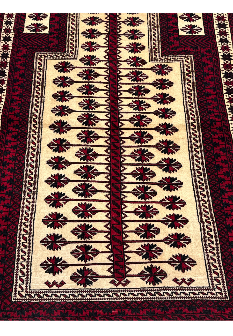 Close-up of the central motif on a 3'6 x 5'4 Persian Baluch Rug.