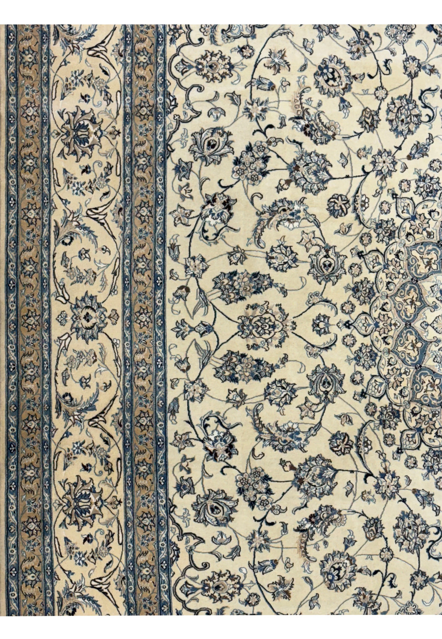 Close-up of intricate floral patterns on a 13 x 19'6 Persian Nain 9LA Wool & Silk Rug