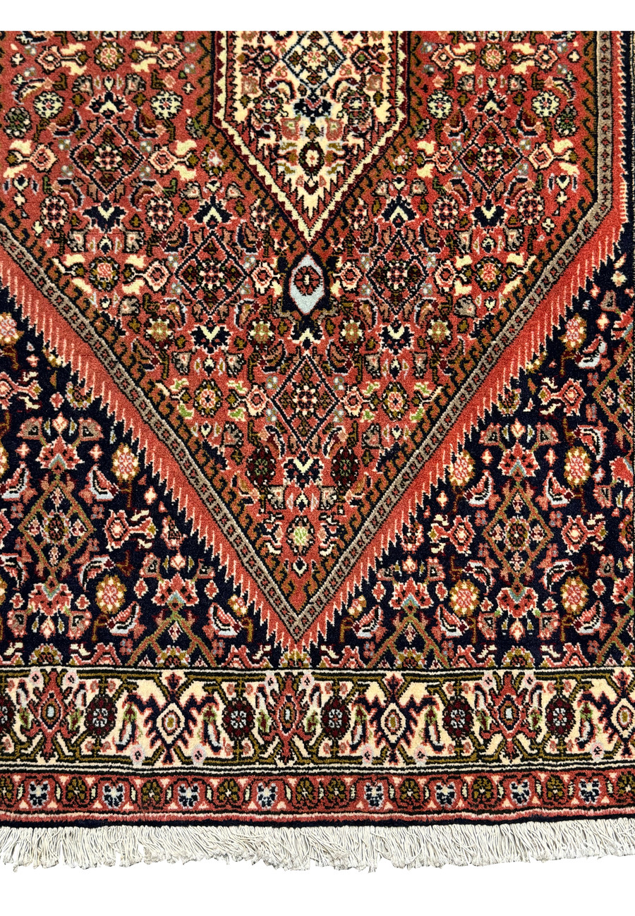 Lower border of 3' x 5'2" Persian Bijar Rug showcasing floral motifs.