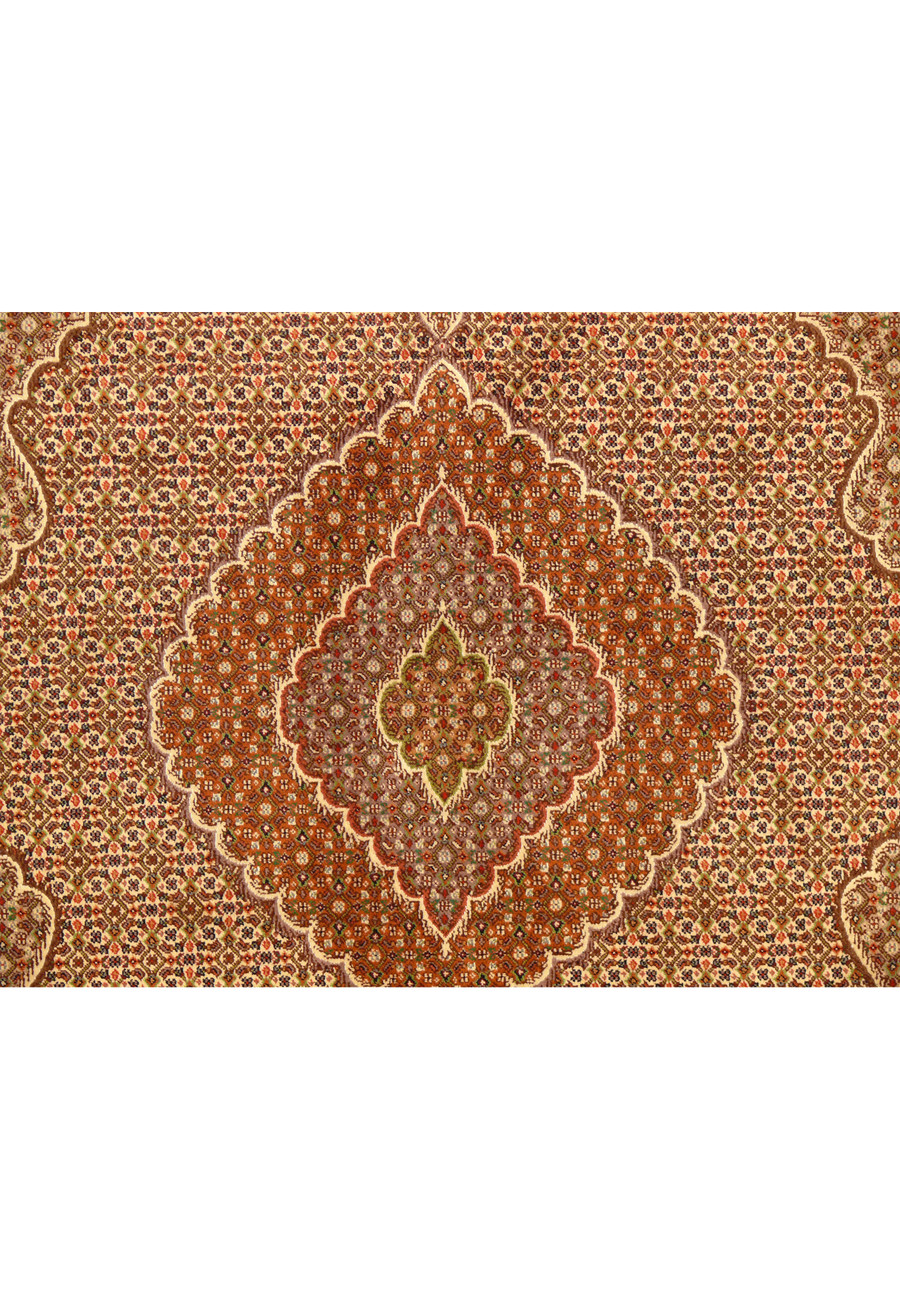 Close-up of the medallion on the 6'8x9'9 Persian Tabriz Mahi Rug, highlighting the intricate motifs and color details.