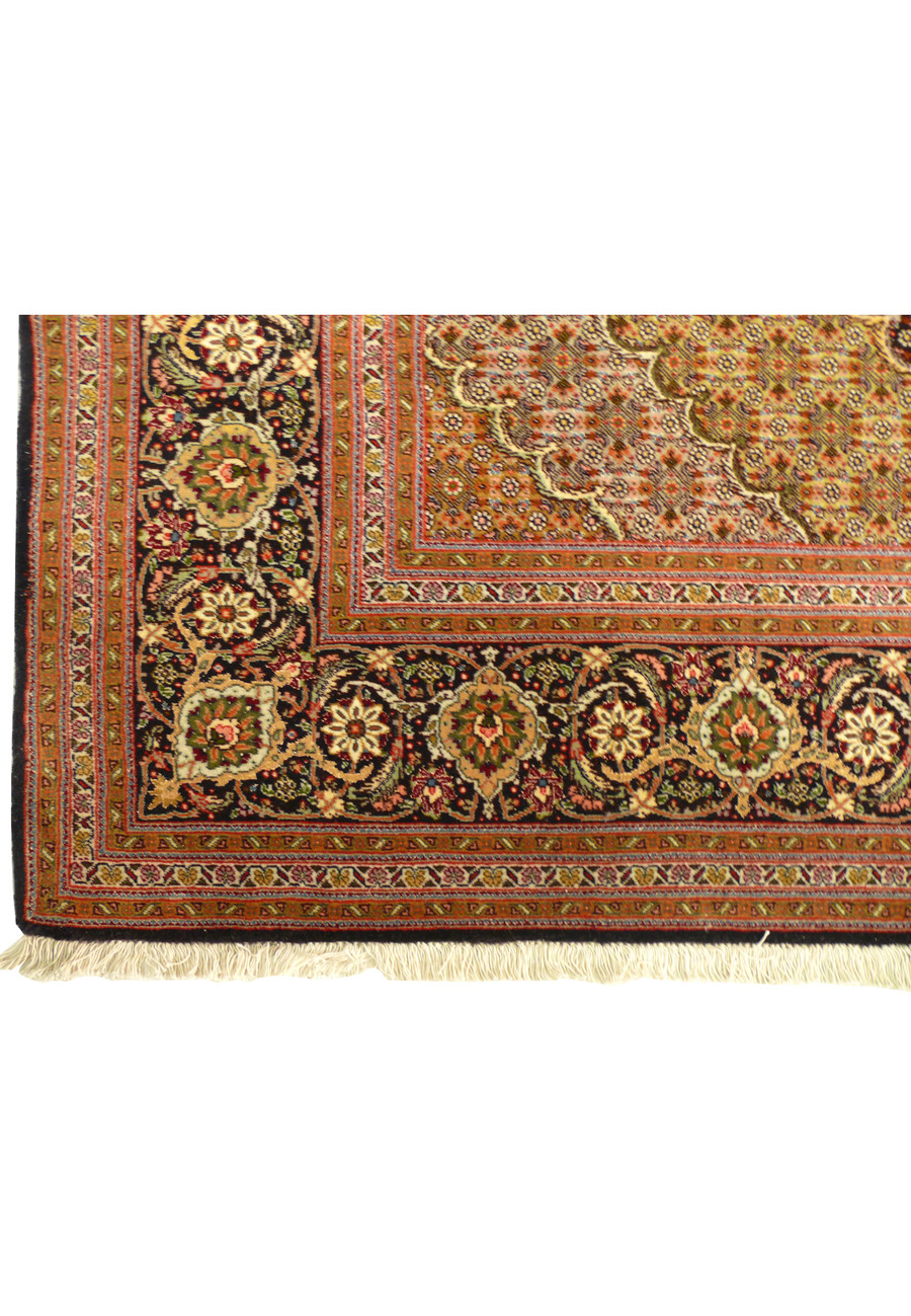 Border of 6'8" x 9'7" Persian Tabriz Mahi 50 Raj Rug with intricate floral patterns and rich colors.