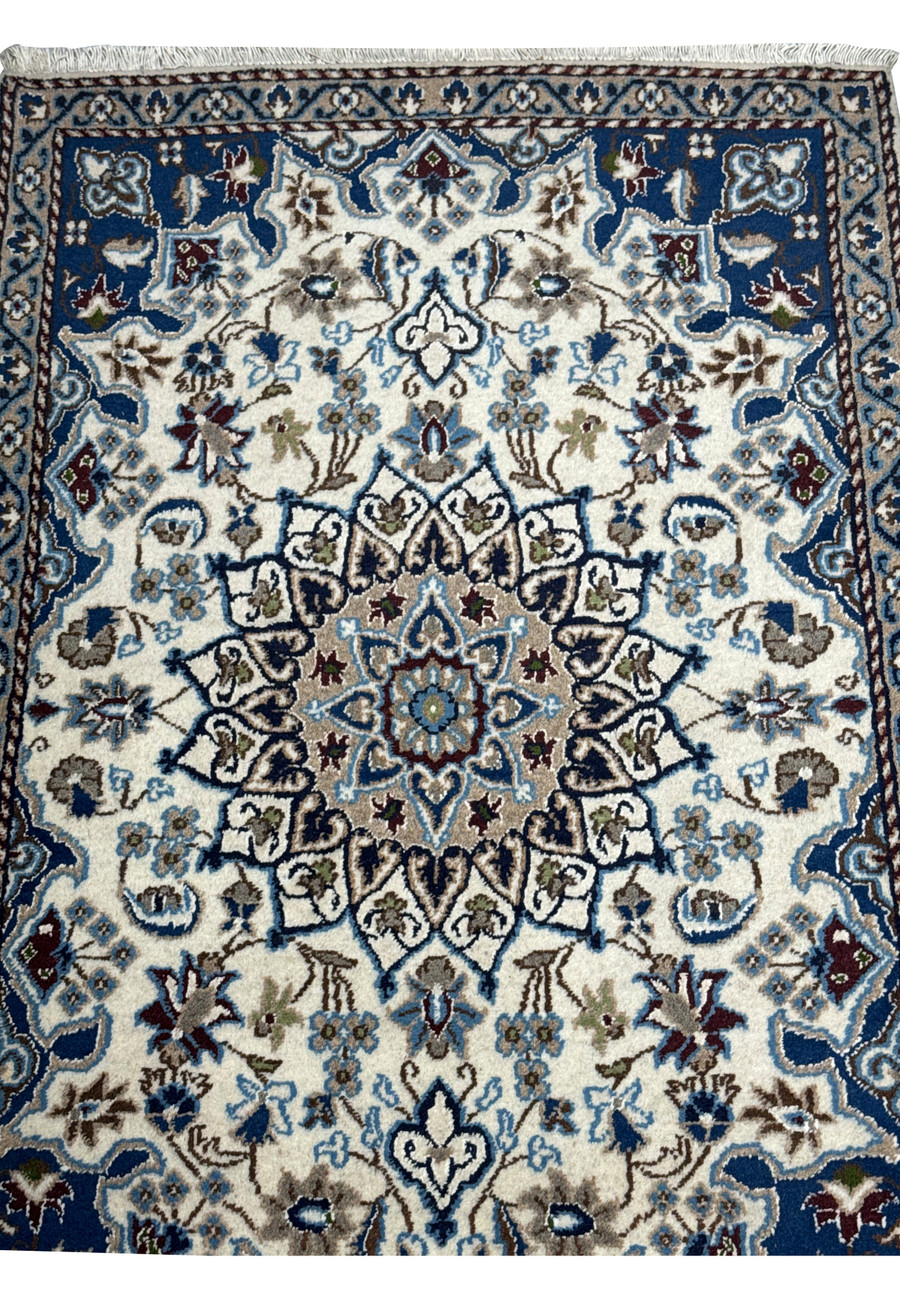 Detailed view of the midfield area of a 3 x 4'6 Nain Persian Rug, showcasing its intricate floral motifs.