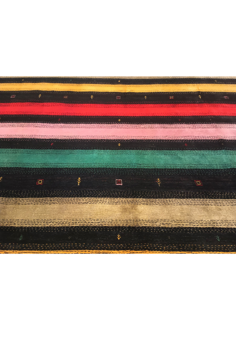 Lower part of 8'3" x 9'11" colorful Gabbeh rug with intricate patterns.