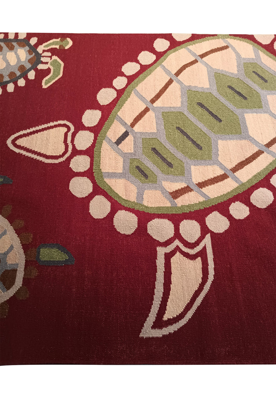 Close-up of turtle motif on wool rug.