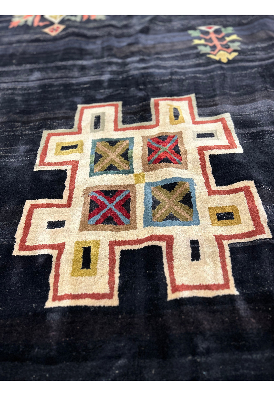 Detailed shot of the geometric patterns on the 11'9" x 14'4" Modern Tribal Gabbeh Rug, emphasizing the vibrant colors and artistry.