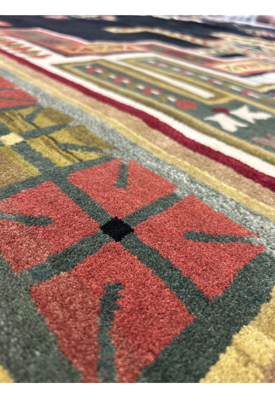 Close-up of tribal motifs on the 11'9" x 14'4" Modern Tribal Gabbeh Rug, showcasing the detailed design and colorwork.