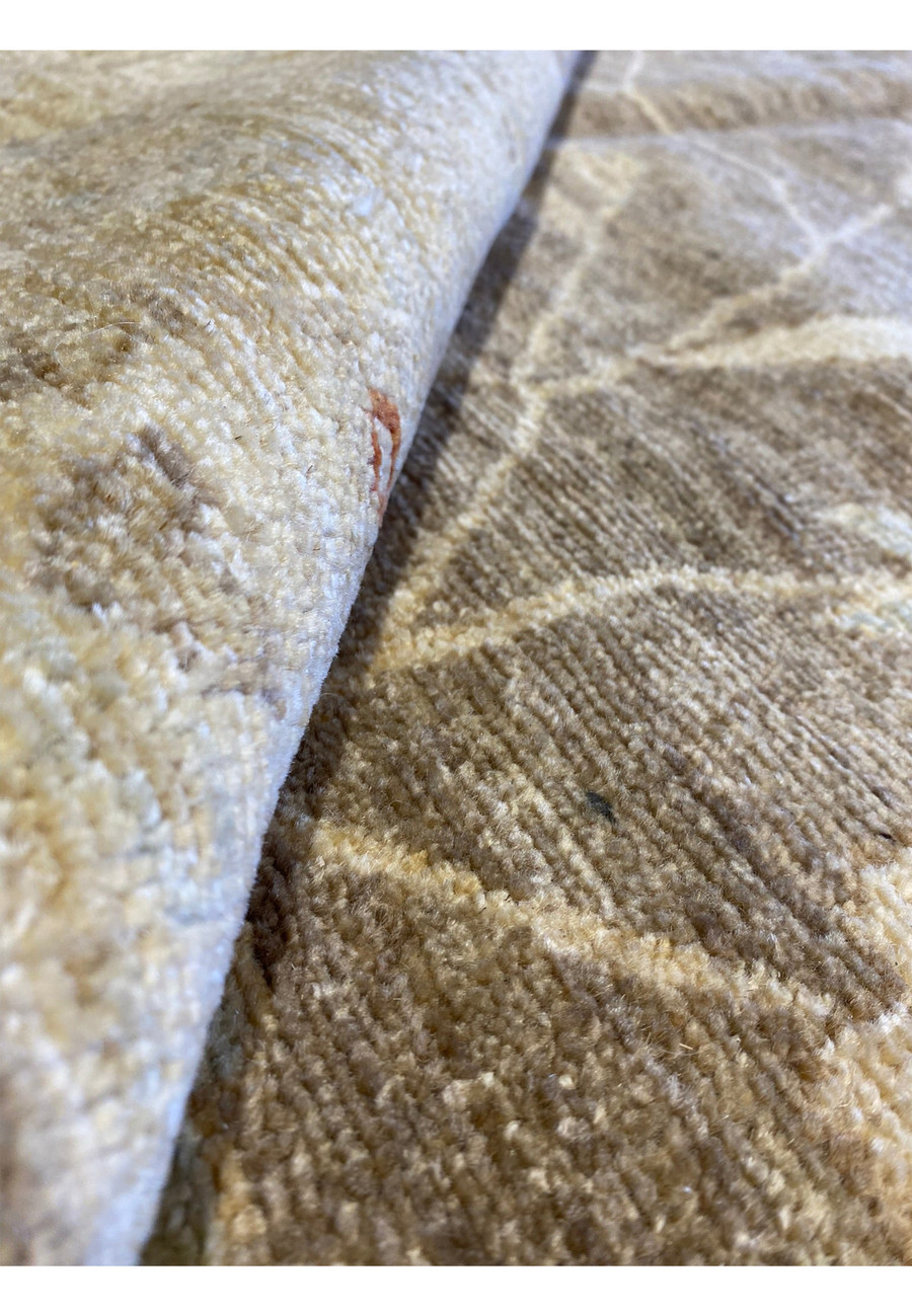 Rolled view of the 16 x 20 Chobi Peshawar Rug to showcase the pile and texture.