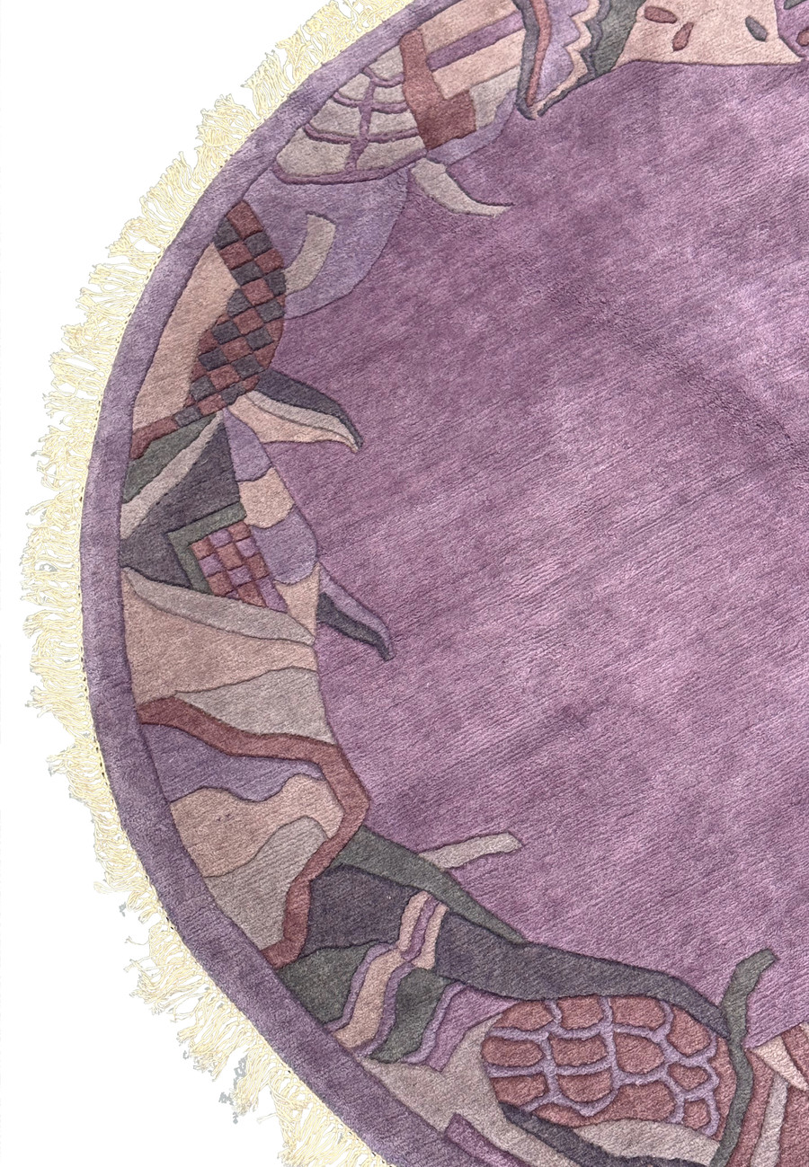 Detailed view of the border on the Nepali Art Deco Rug, displaying abstract geometric and organic patterns in complementary colors.