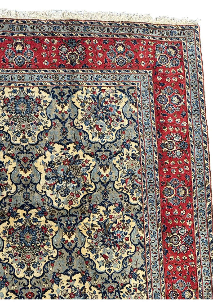 Zoomed-in border of the 8'2 x 11'6 Persian Kashan Rug highlighting intricate red floral border with individual flower heads and vine work