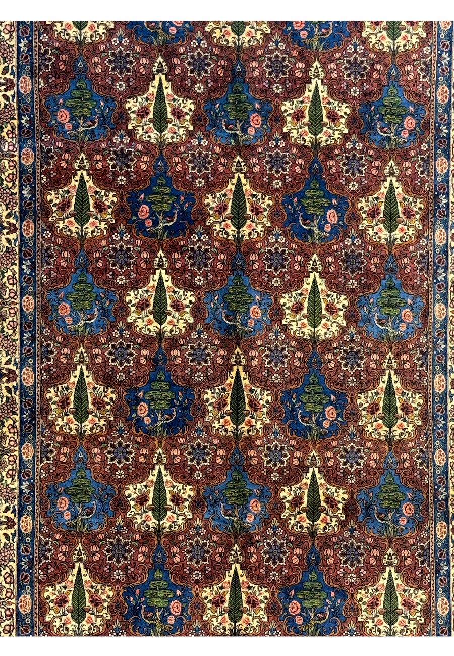 Close-up of the midfield floral design on a Persian Bakhtiar Rug, showcasing detailed trees, leaves, and bird motifs.