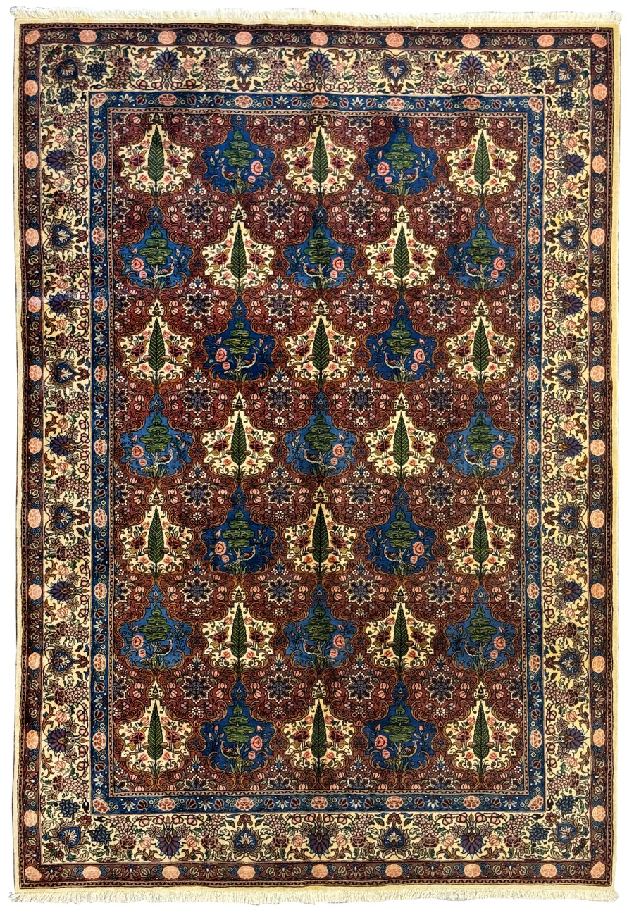 Full view of a 6'9 x 10'3 Persian Bakhtiar Rug, featuring intricate floral patterns, vines, trees, and birds in vibrant colors.