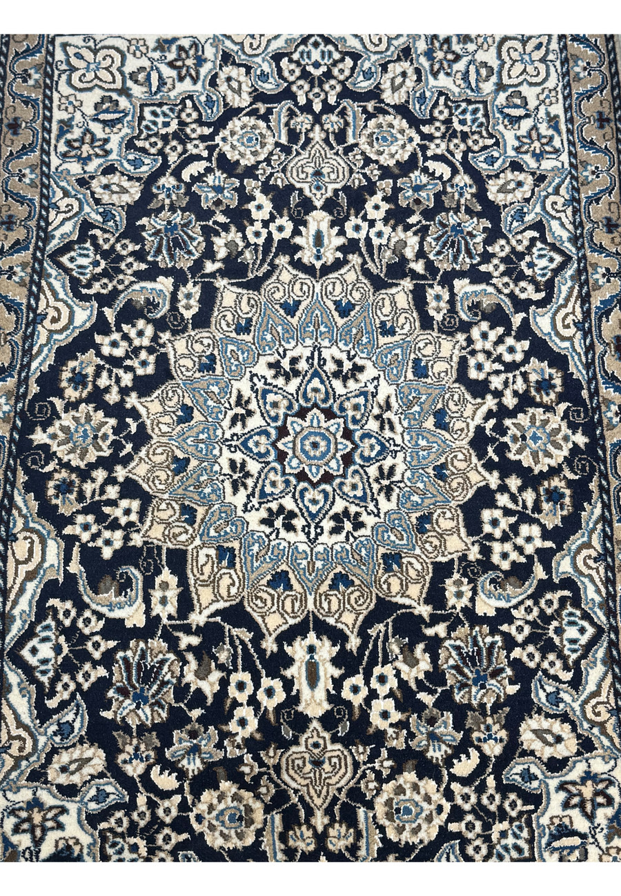 Close-up of medallion in 3'1 x 5 Persian Nain Rug with navy, beige, and blue accents