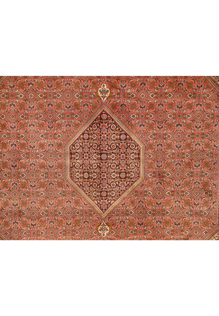 Close-up of the central hexagonal medallion in a handwoven 8 x 11 Persian Bijar Rug with intricate geometric patterns.