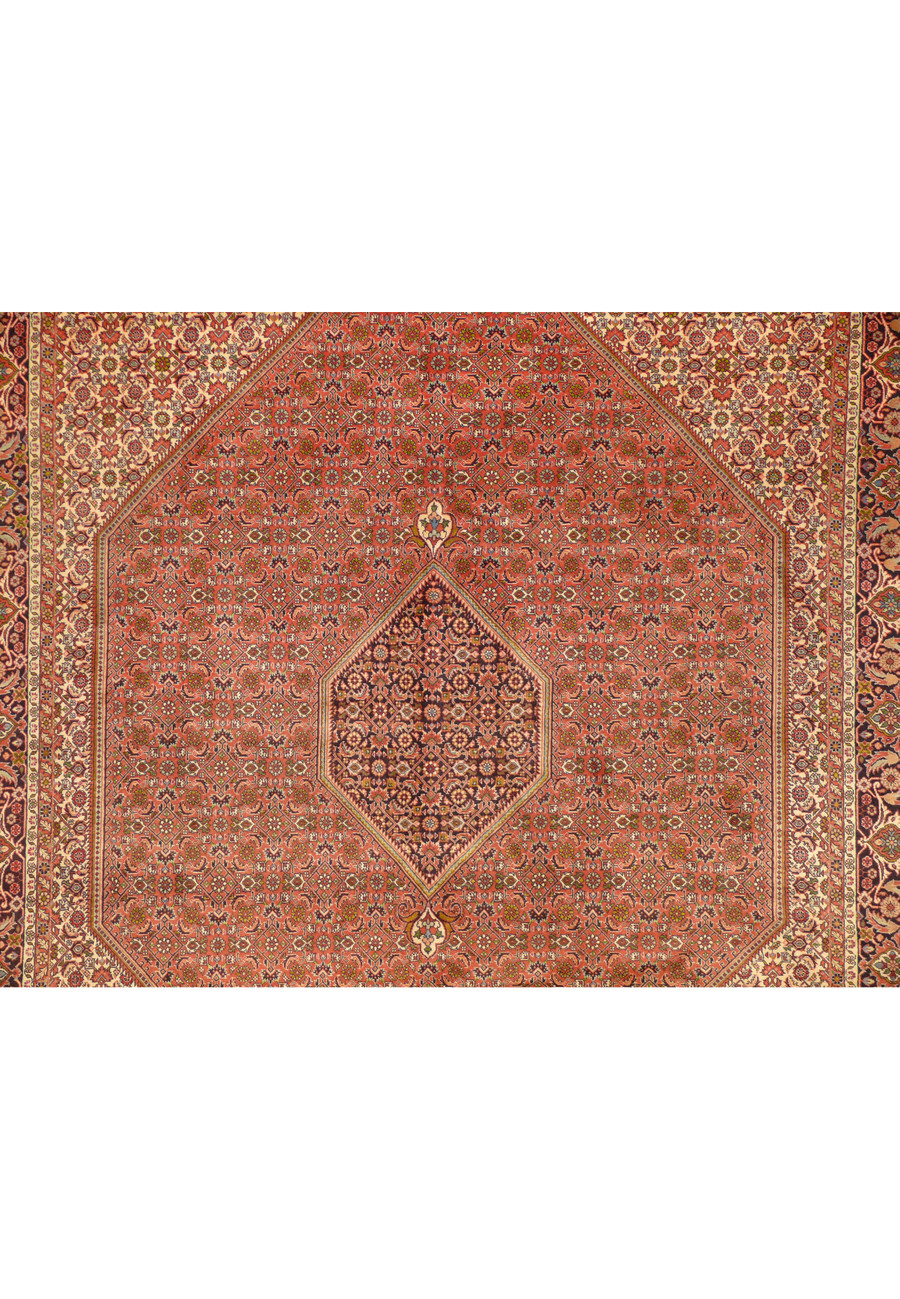 Central field of a handwoven Persian Bijar Rug, showcasing floral and geometric patterns in rust and navy.