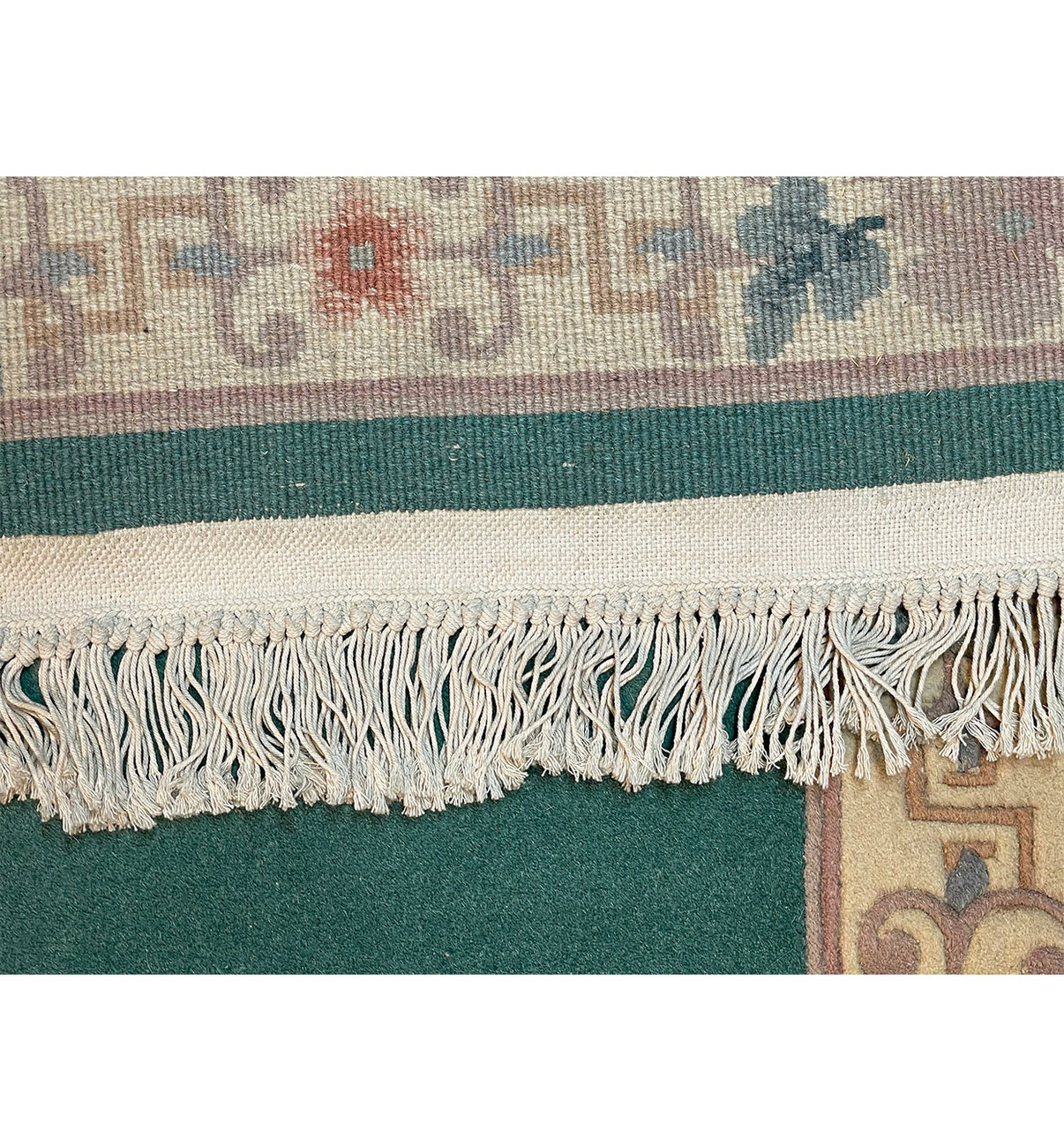 Backside of the Walter Nichols Art Deco Runner showcasing its cotton foundation and durable construction.