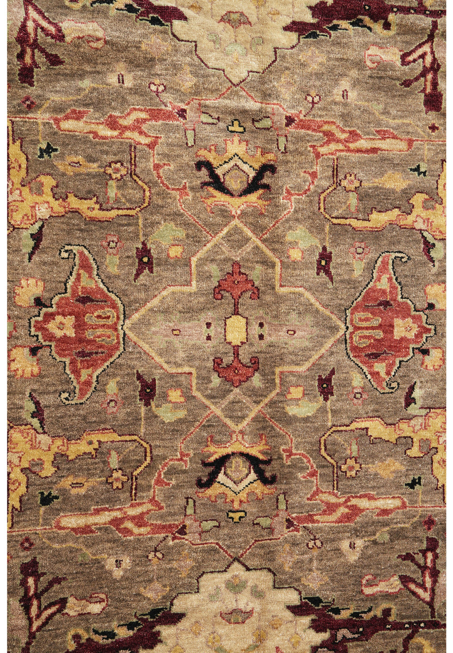 Close-up midfield design of Afghan Chobi Peshawar Rug with taupe and rust floral motifs