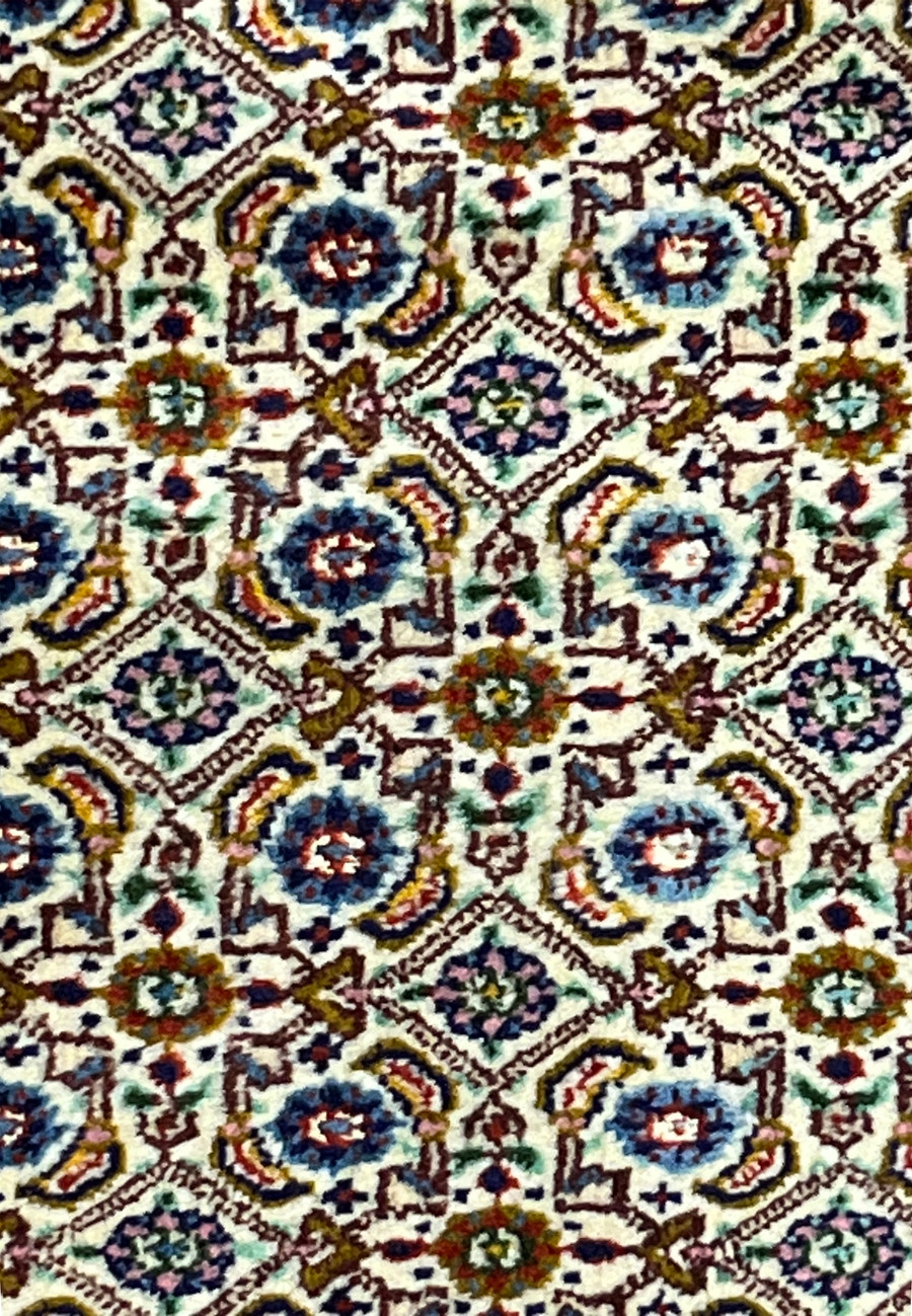 Detailed close-up of Persian Moud rug field pattern with blue and olive accents