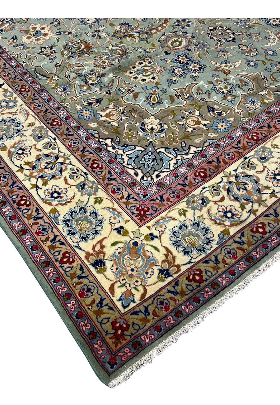 Corner and fringe detail of the Persian Tabriz rug highlighting weave and finishing
