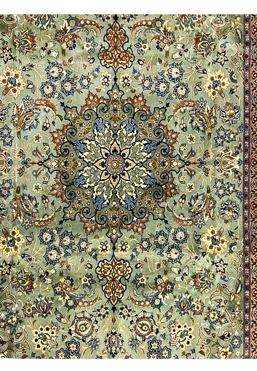 Close-up of the central floral field and medallion pattern of the Tabriz rug