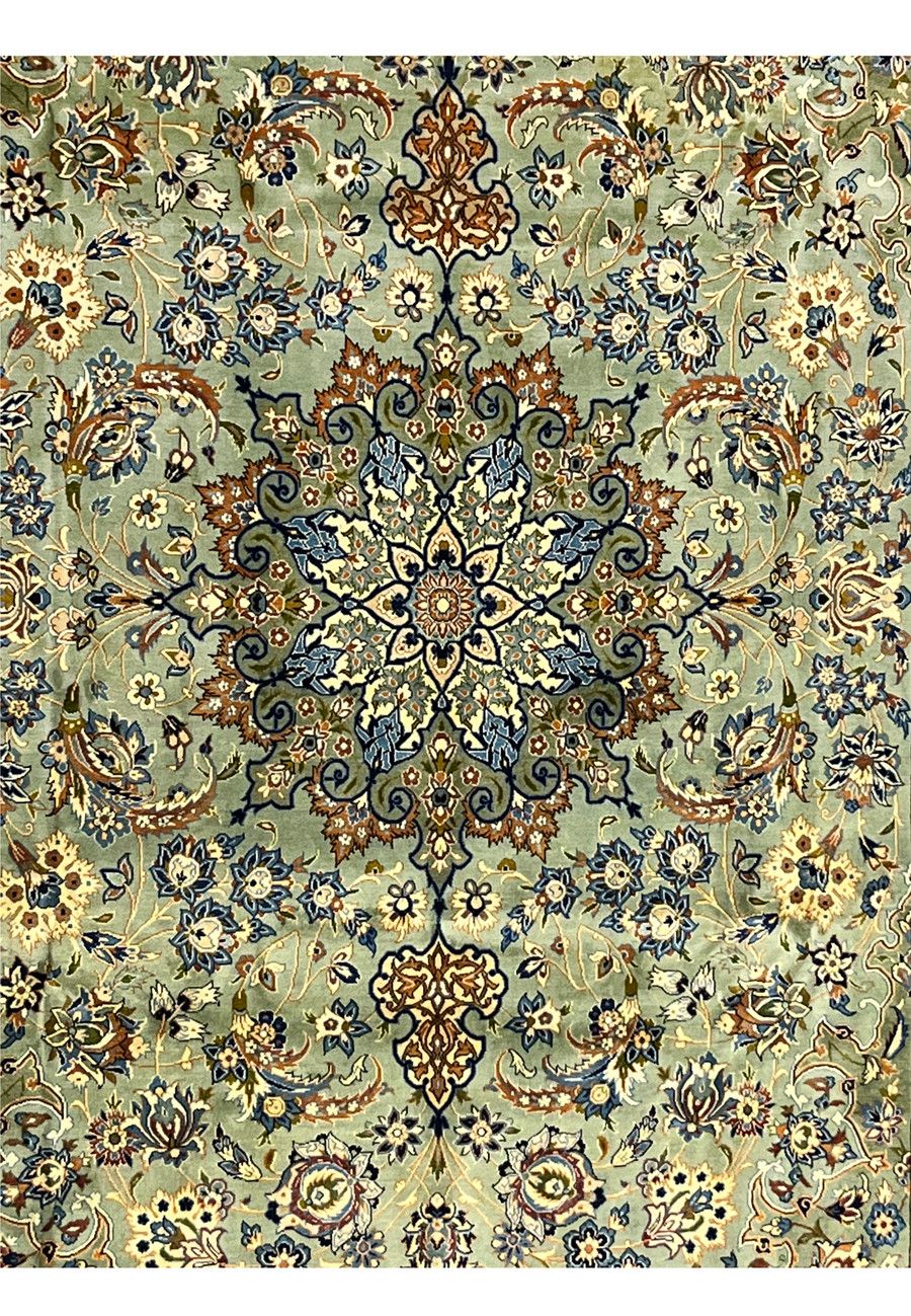 Center medallion of Persian Tabriz rug with floral starburst pattern in blue and ivory