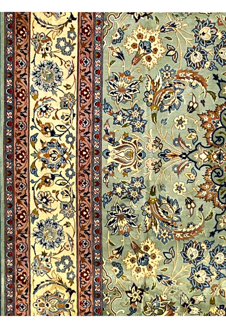 Side border detail of Tabriz rug featuring ivory floral vines and guard stripes