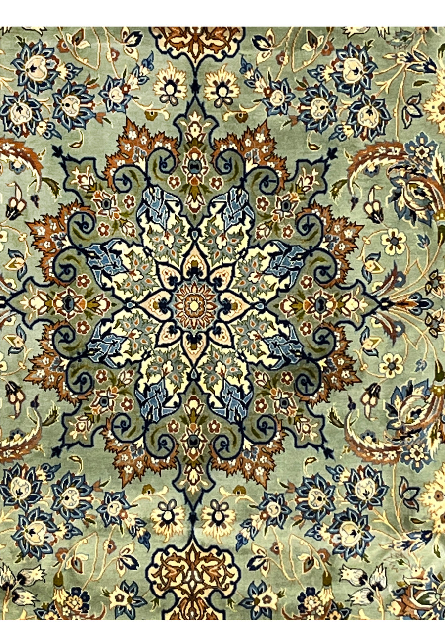 Macro view of the medallion showing intricate hand-knotted floral details