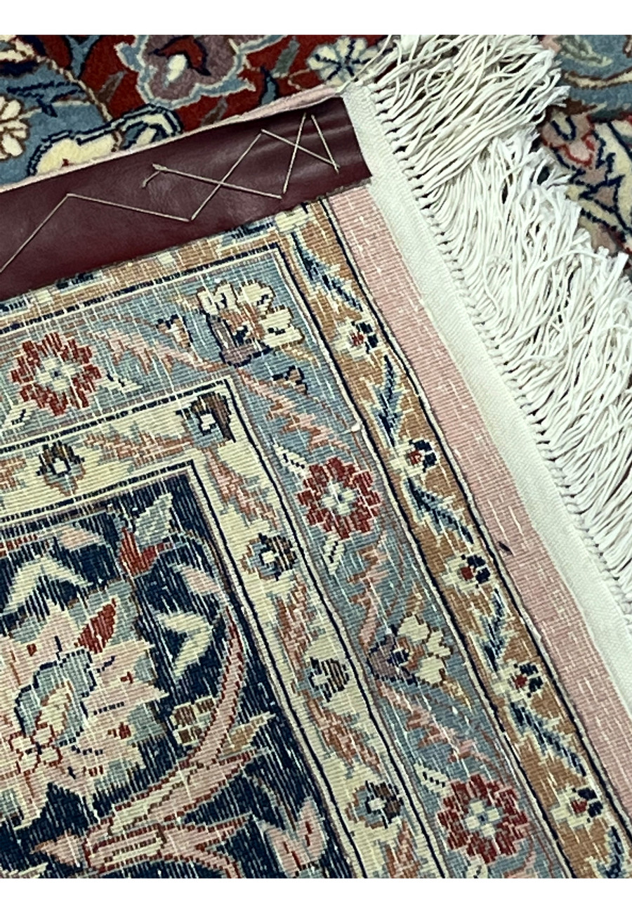 Backside close-up of Persian Tabriz rug showing fine hand-knotted weave and knot density
