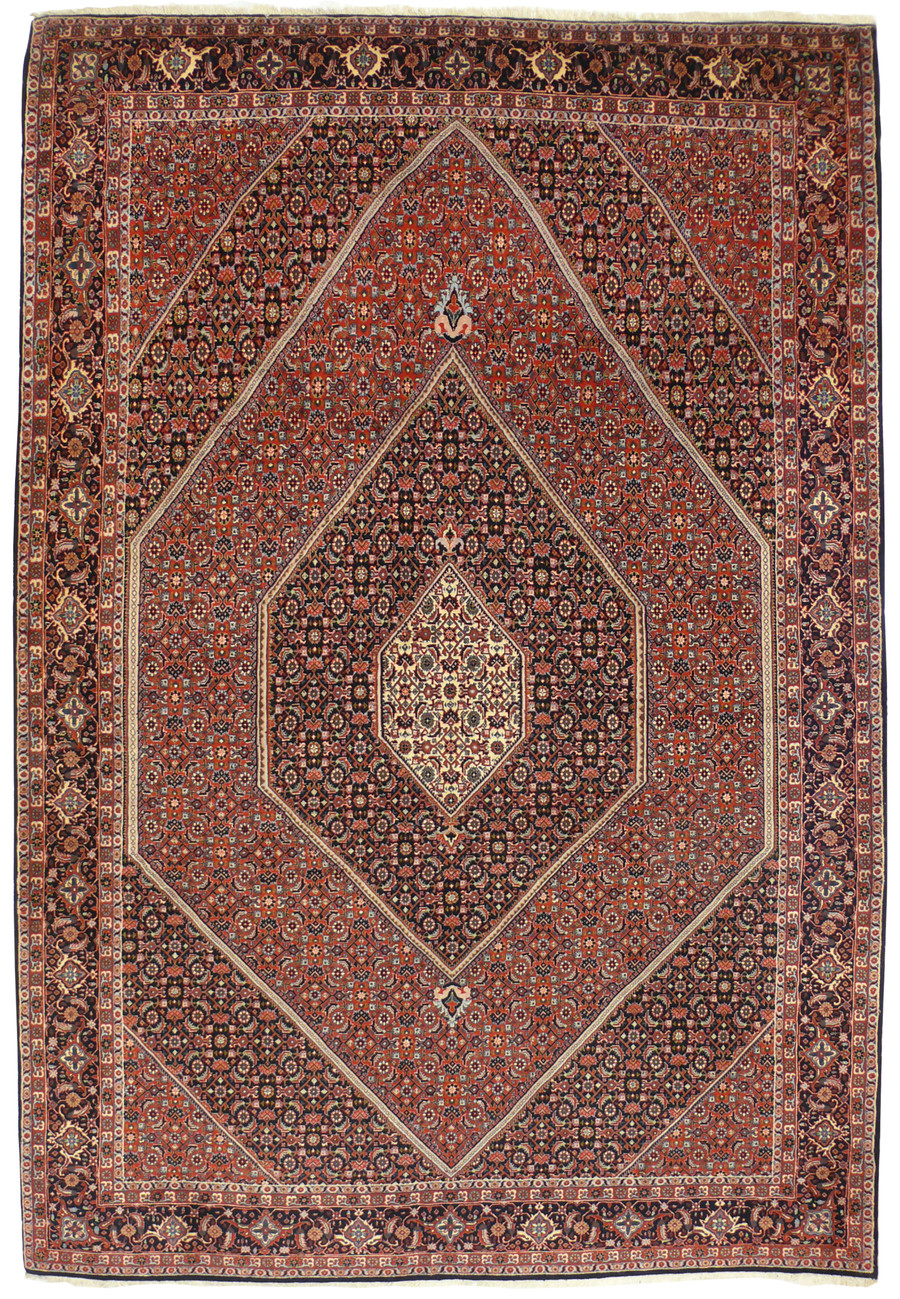 Hand knotted 6'8 x 10'4 Bijar Persian iron rug with red geometric medallion and dark navy border shown flat on white background