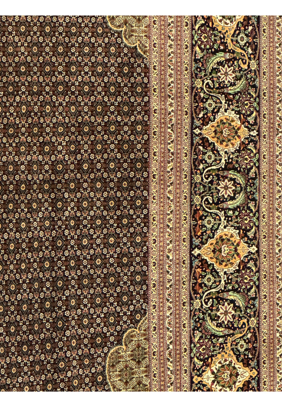 Detailed border view of Persian Tabriz Mahi rug displaying scrolling floral vines, balanced spacing, and classic Tabriz color harmony